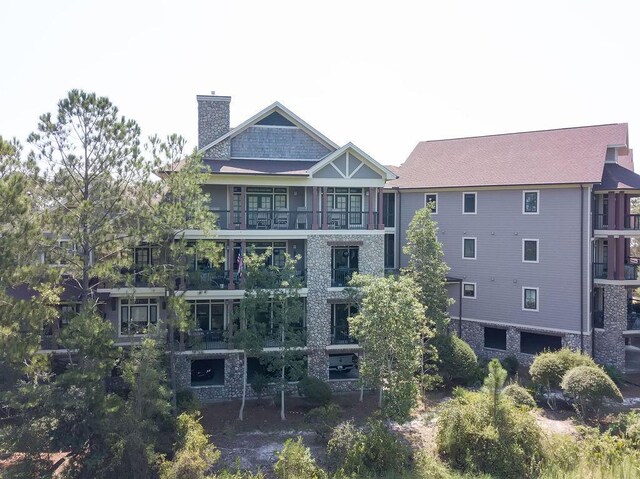 back of property with a balcony