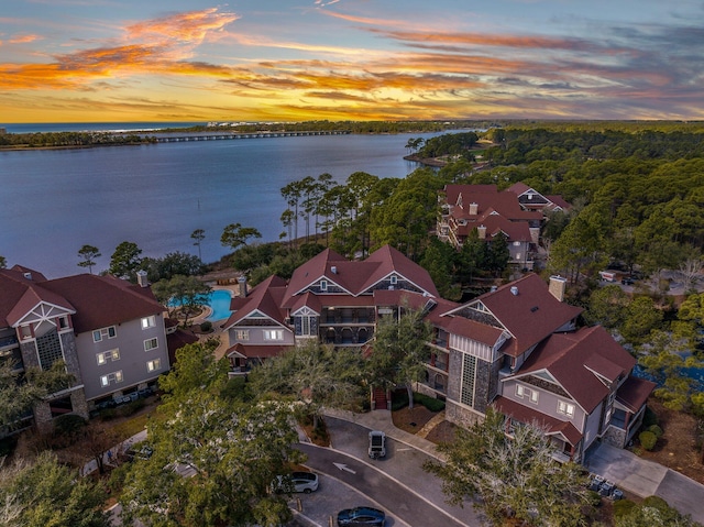 birds eye view of property with a residential view and a water view