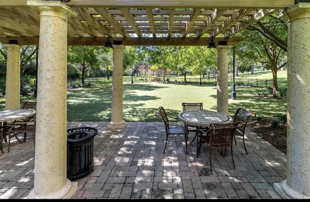 view of patio / terrace with central AC unit and a pergola