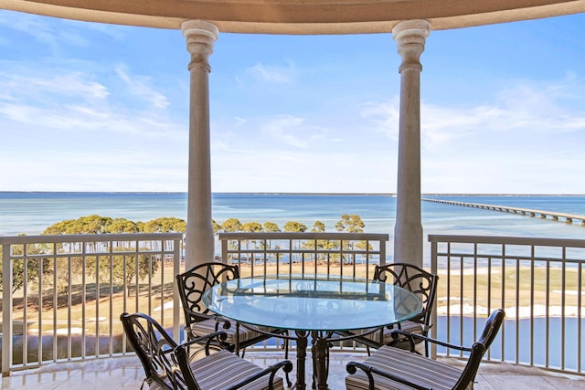 balcony featuring a water view