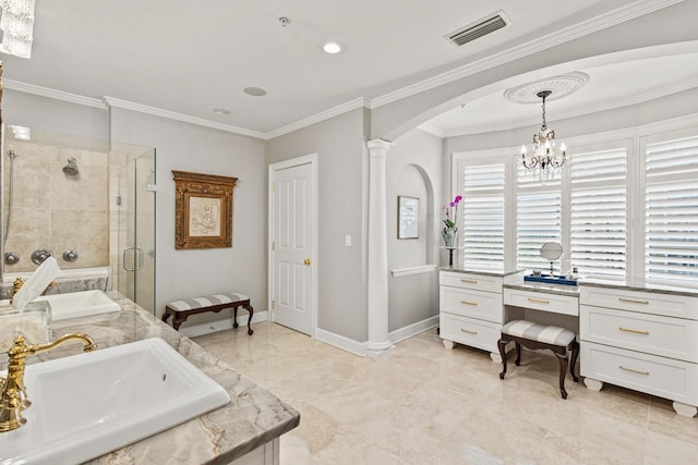 bathroom with ornate columns, crown molding, and a shower with shower door