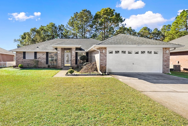 single story home with a garage, cooling unit, and a front lawn