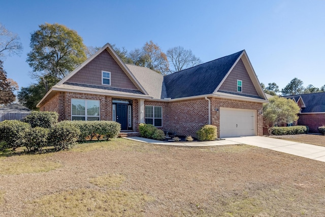 craftsman inspired home featuring concrete driveway, a garage, brick siding, and a shingled roof