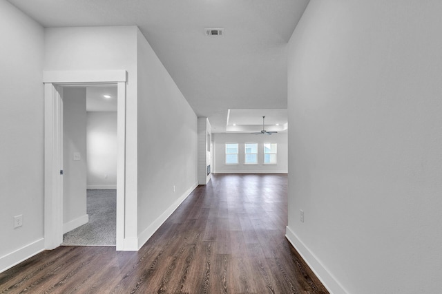 hallway with dark hardwood / wood-style flooring