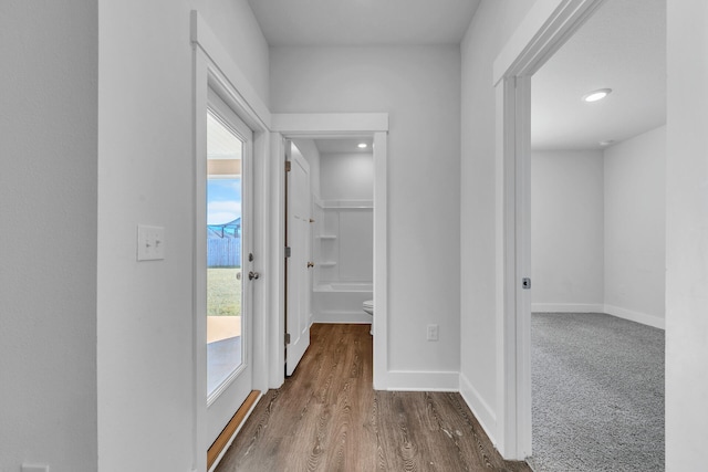 corridor with carpet floors