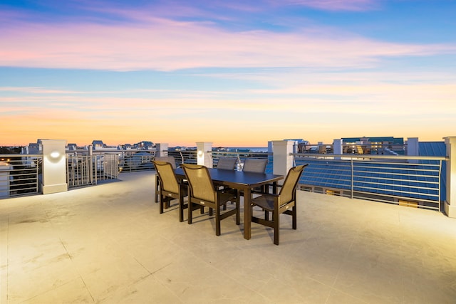 view of patio terrace at dusk