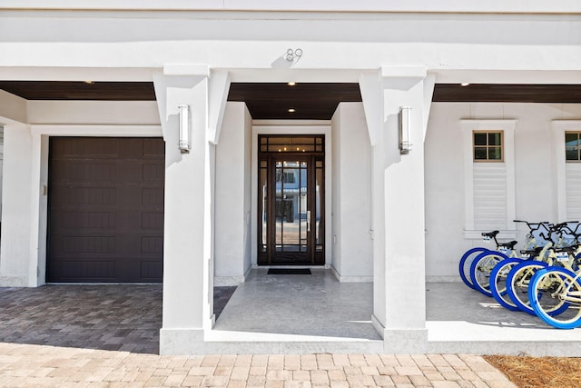 view of exterior entry with a garage