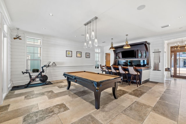 playroom with wood walls, billiards, and ornamental molding