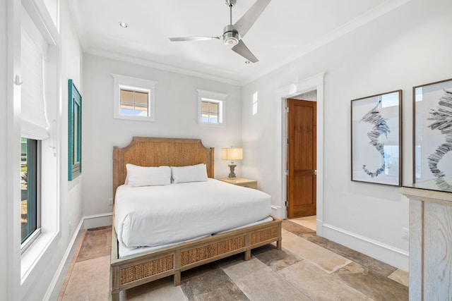 bedroom with ceiling fan and crown molding