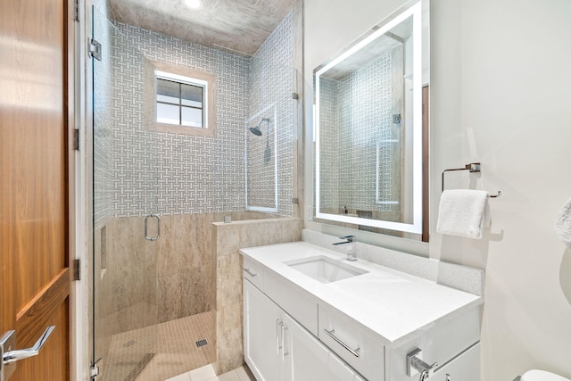 bathroom featuring vanity and walk in shower