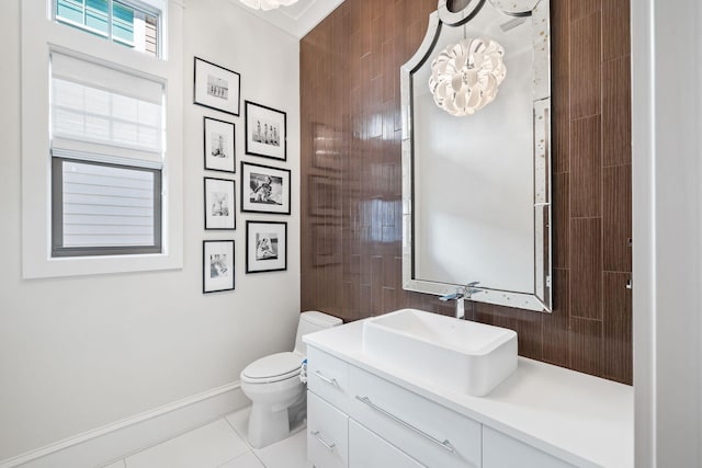 bathroom with tile patterned flooring, vanity, and toilet