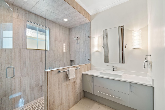 bathroom with tile patterned flooring, vanity, and a shower with shower door