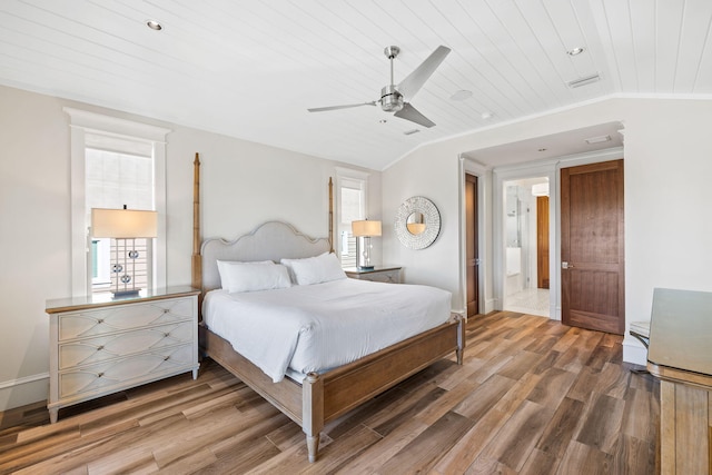 bedroom featuring hardwood / wood-style flooring, ceiling fan, wooden ceiling, and vaulted ceiling