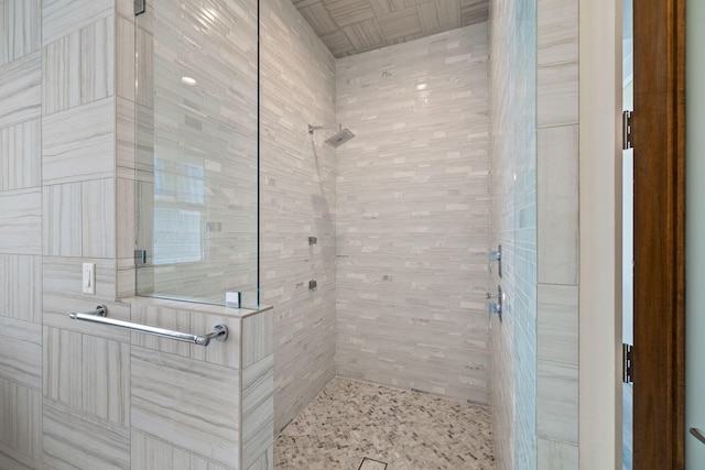 bathroom with tiled shower