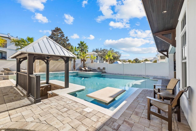 view of swimming pool featuring a gazebo and a patio