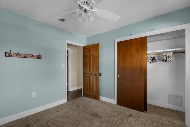 unfurnished bedroom with carpet floors, ceiling fan, baseboards, and a closet