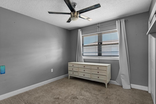 bedroom with light carpet, ceiling fan, a textured ceiling, and baseboards