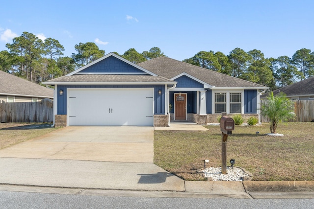 view of front of property with a garage and a front yard