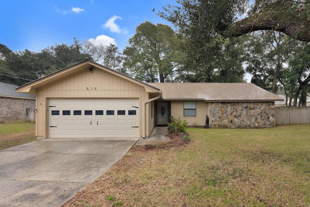 ranch-style home with a garage and a front lawn