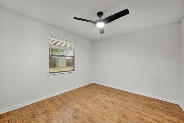 unfurnished room featuring light hardwood / wood-style flooring and ceiling fan