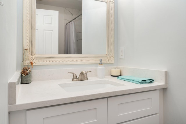 bathroom with a shower with curtain and vanity