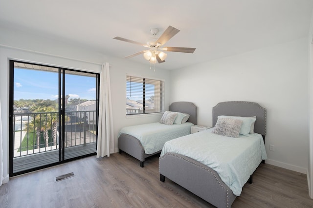 bedroom with access to exterior, ceiling fan, and hardwood / wood-style flooring