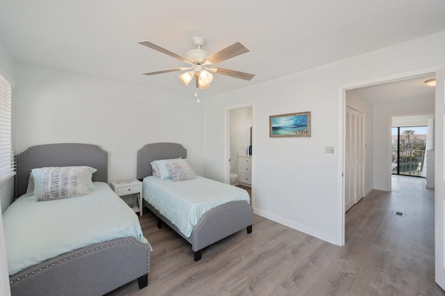 bedroom with ceiling fan and wood-type flooring