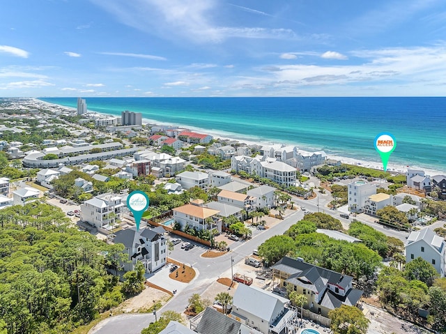 birds eye view of property featuring a water view and a view of the beach