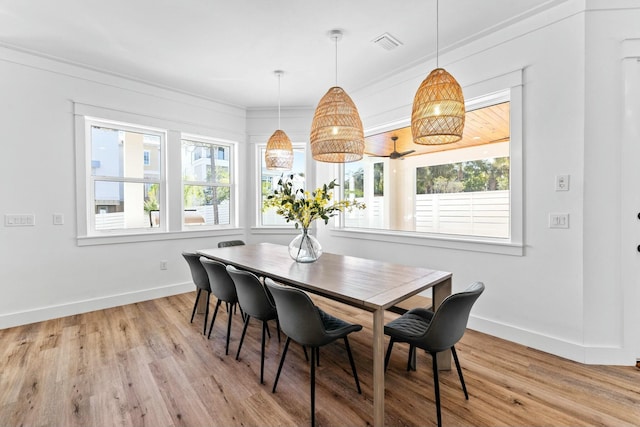 dining area with crown molding, ceiling fan, and a wealth of natural light