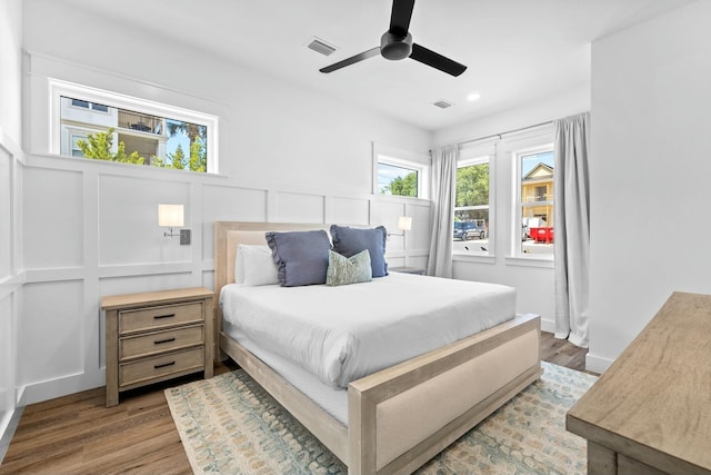 bedroom featuring hardwood / wood-style floors and ceiling fan