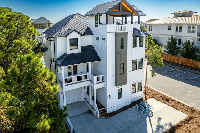 view of front facade featuring a balcony and a garage