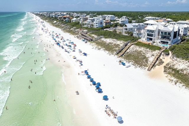 bird's eye view featuring a view of the beach and a water view