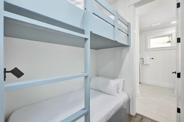 bedroom with wood-type flooring