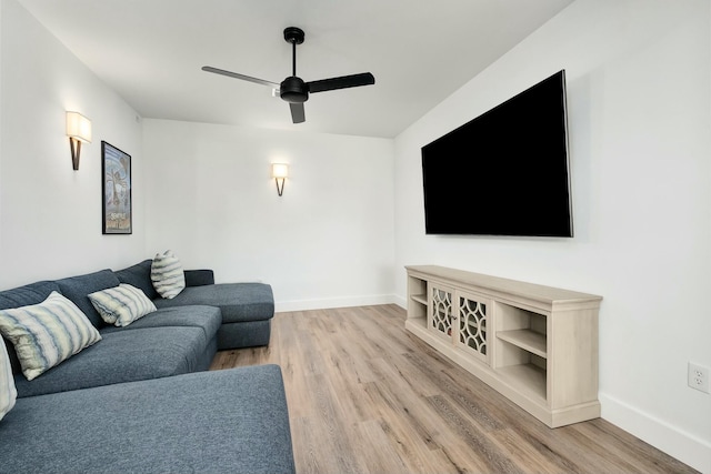 living room with hardwood / wood-style floors and ceiling fan