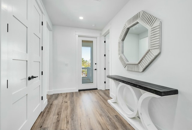 foyer entrance with light wood-type flooring