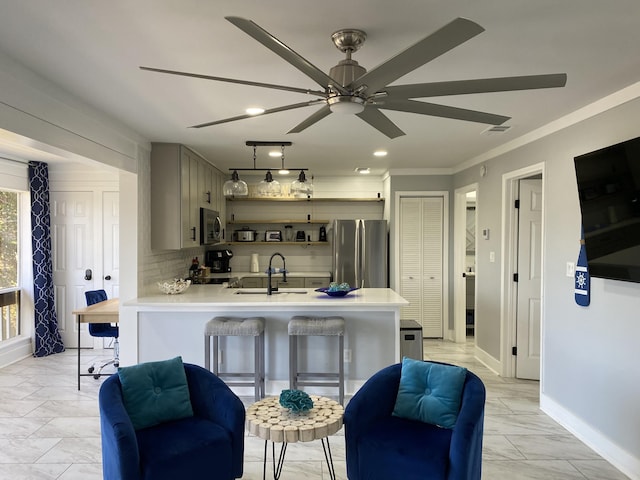 kitchen with backsplash, stainless steel appliances, crown molding, sink, and gray cabinets