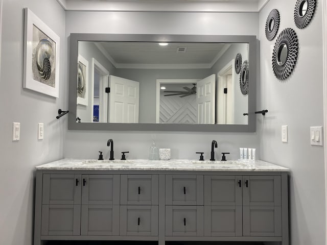 bathroom featuring vanity and crown molding