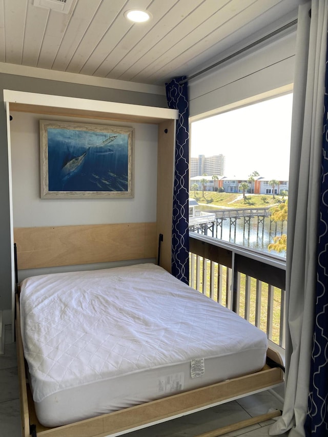 bedroom with a water view and wooden ceiling