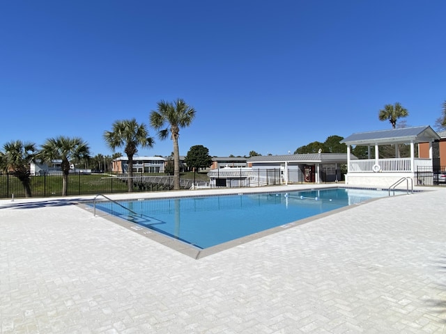 view of swimming pool with a patio