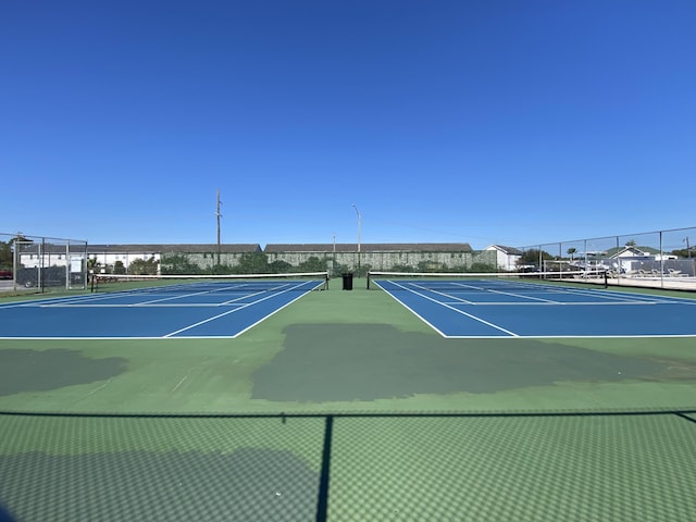 view of tennis court with basketball court