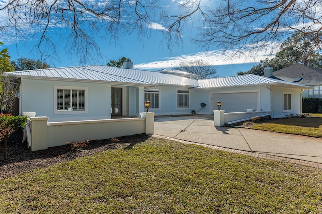 single story home featuring a front yard and a garage