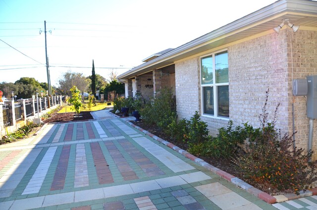 501 Benning Dr, Destin, FL 32541 - view of side of property featuring a patio