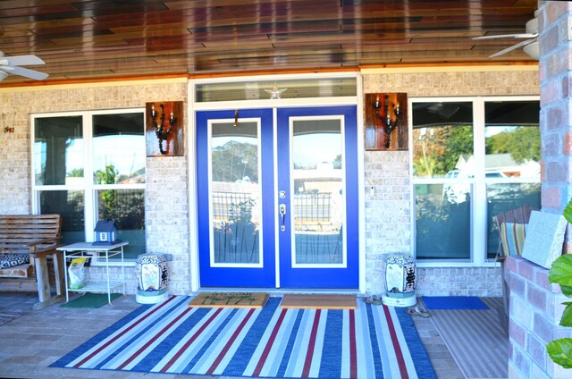 501 Benning Dr, Destin, FL 32541 - view of exterior entry with ceiling fan and french doors
