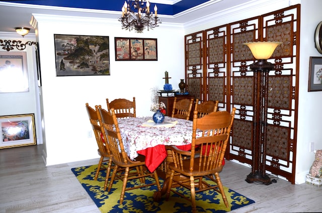 501 Benning Dr, Destin, FL 32541 - dining area featuring wood-type flooring and a notable chandelier