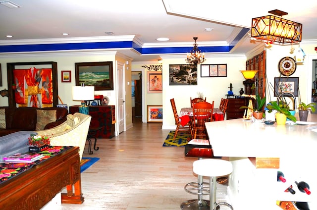 501 Benning Dr, Destin, FL 32541 - dining area with a chandelier, crown molding, and light hardwood / wood-style floors