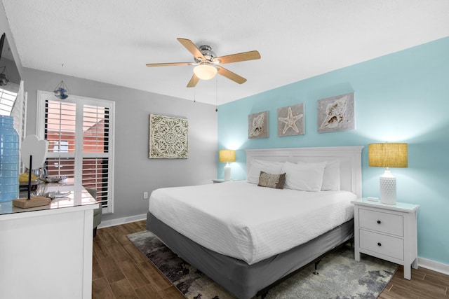 bedroom with multiple windows and ceiling fan