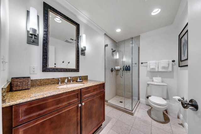 bathroom featuring tile patterned floors, ornamental molding, vanity, toilet, and a shower with shower door