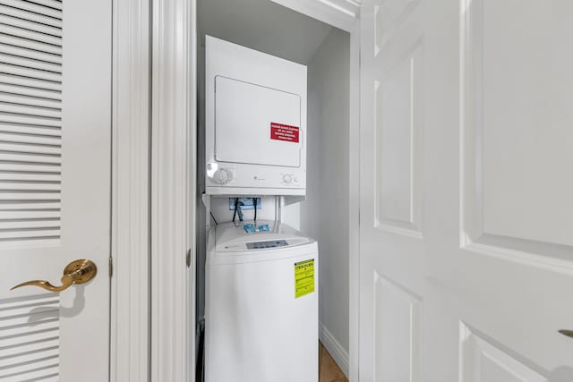 washroom with stacked washer / drying machine