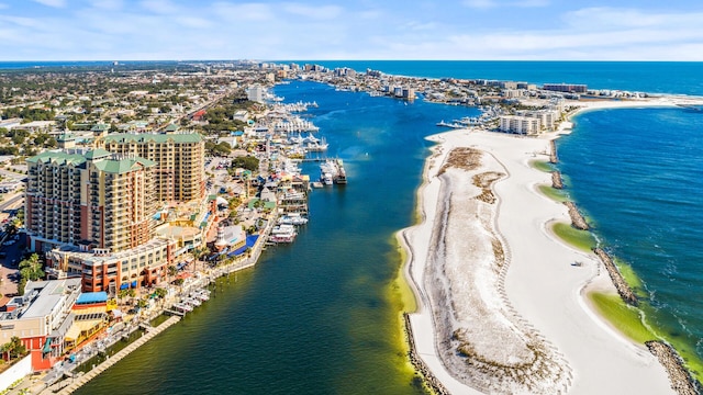 aerial view with a water view and a view of the beach