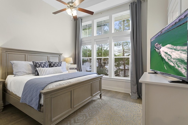 bedroom with ceiling fan and light hardwood / wood-style flooring